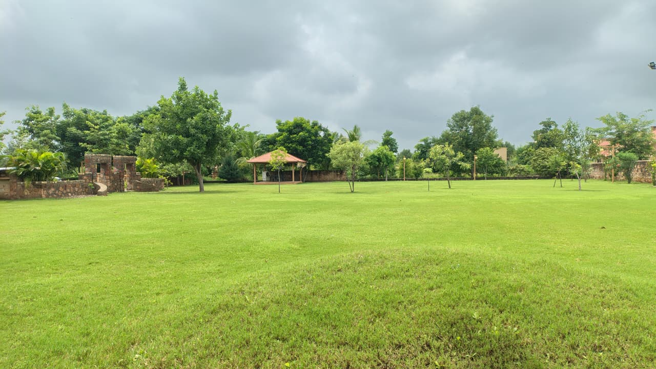 Wide farmhouse lawn with gazebo developed by GreenLand Landscape